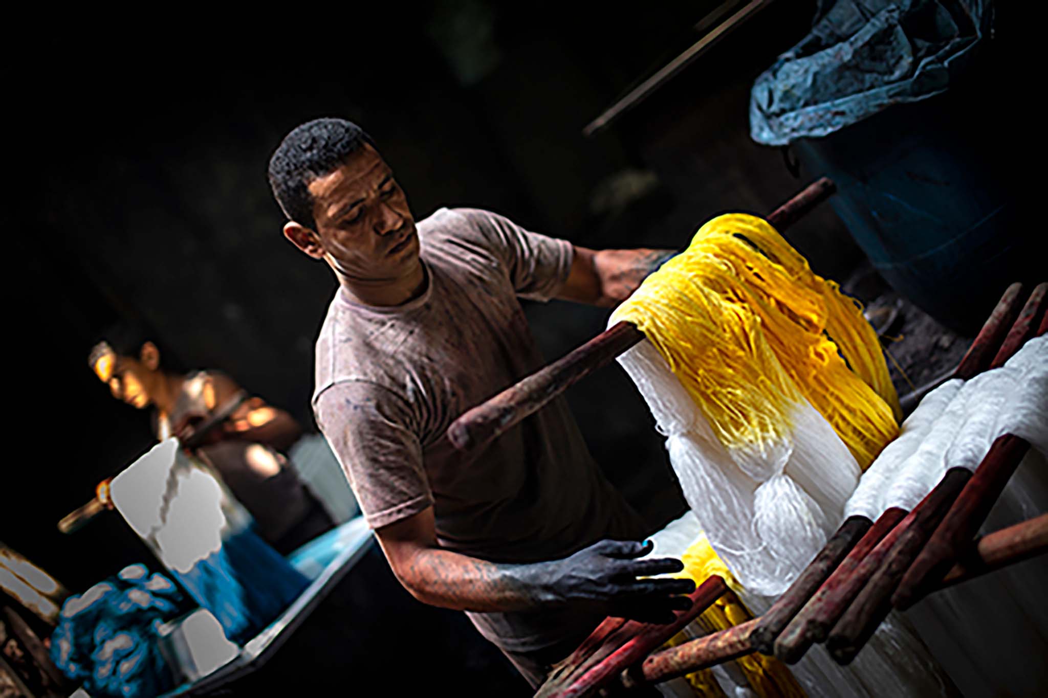 A Man Dyeing Fabric